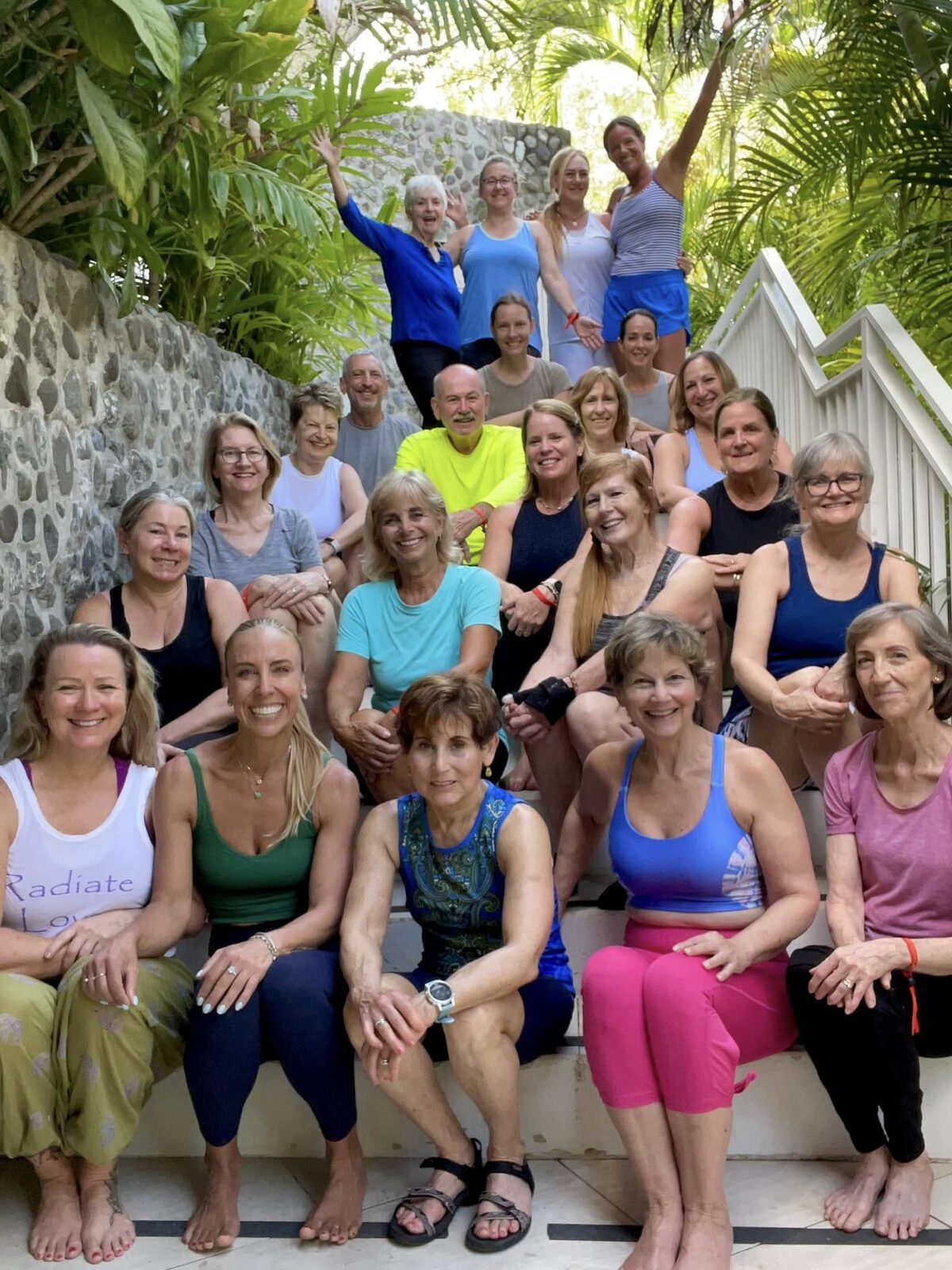 Retreat group posing together on stone steps